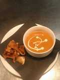 Cream of tomato soup with parsnip crisps