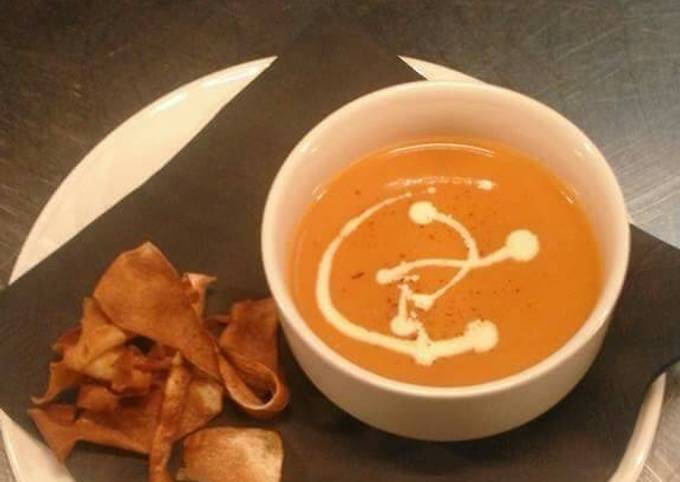 Cream of tomato soup with parsnip crisps