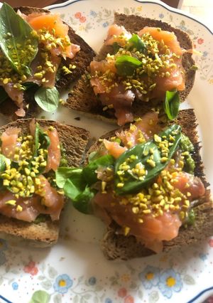 A picture of Bruschetta with Smoked Salmon and Pesto.