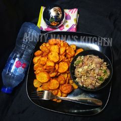 A picture of Spiced Chip's with onion and egg sauce.