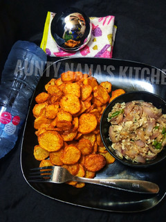 A picture of Spiced Chip's with onion and egg sauce.