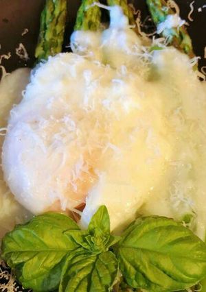 A picture of Poached Eggs with Asparagus and Parmesan Cream.