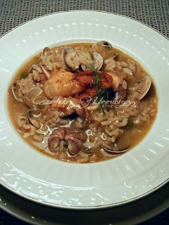 Una foto de Arroz caldoso con almejas y sepia