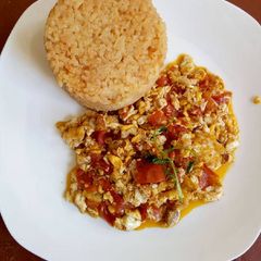 A picture of Fried Eggs with Tumeric Rice.