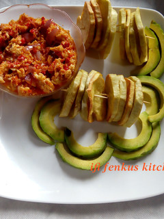 A picture of Fried sweet potatoes and egg sauce.