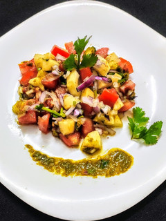 A picture of Salad with chutney.