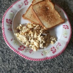 A picture of Pan toast with scrambled eggs.