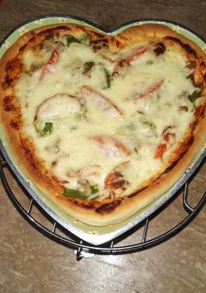 A picture of Heart shape pizza.
