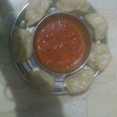 A picture of Soya Momos with chutni.