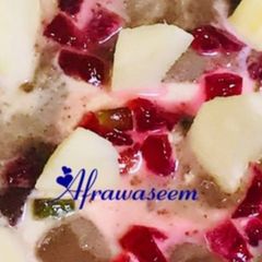 A picture of A Bowl Of Richness with apples and chocolate yoghurt.