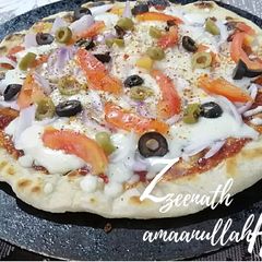 Tawa Mixed Veg Pizza without Yeast and Baking powder A picture of Tawa Mixed Veg Pizza without Yeast and Baking powder.