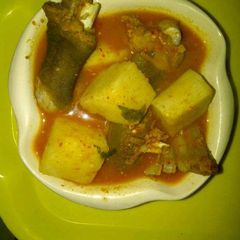 A picture of Yam and goat meat tomato peppersoup.