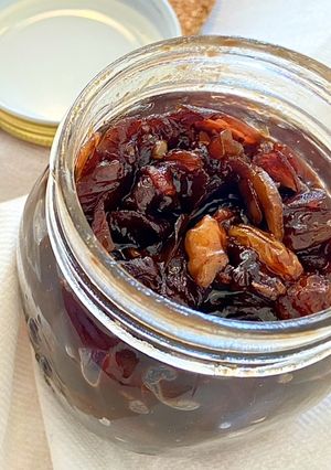 A picture of Red onion chutney with nuts and raisins.
