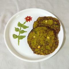 A picture of Corn spinach pan handvo.