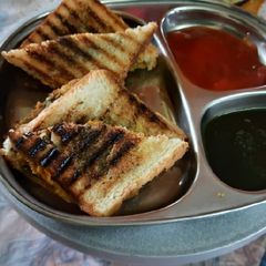A picture of Potato bhaji stuff white bread grilled sandwich for breakfast.
