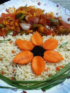 A picture of Chicken shashlik with fried rice.