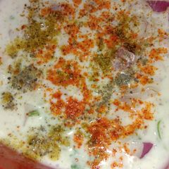 A picture of Onion cucumber Raita.