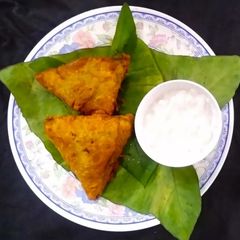 A picture of Colocasia leaves (Patra)Samosa.