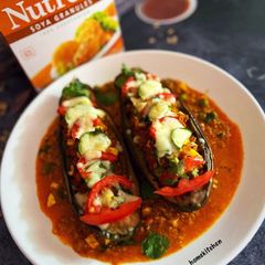 A picture of Soya Brinjal Bharta Stuffed Eggplant Boat in Soyabean curry.