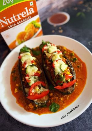 A picture of Soya Brinjal Bharta Stuffed Eggplant Boat in Soyabean curry.