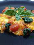 Ravioli with Burrata and Basil Pesto Filling, with Cherry Tomatoes and Greens