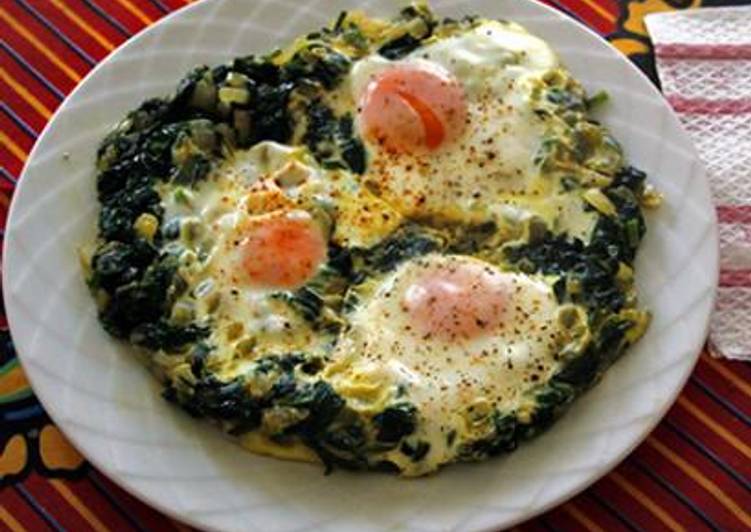 Coddled eggs served on spinach