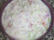 A picture of onion tomato raita
