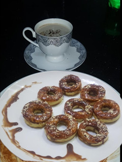 A picture of Baked doughnuts with nutella glazed.