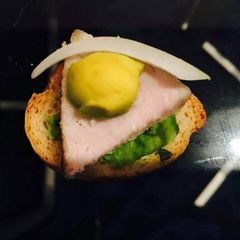 A picture of Bread with ham.