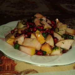 A picture of Peanuts and fruit salad.