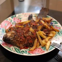 A picture of Chips Nd grilled croaker fish.