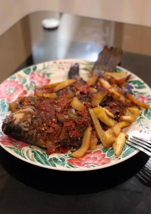 A picture of Chips Nd grilled croaker fish.