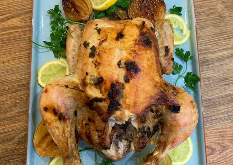 Steps to Make Award-winning Garlic butter roast chicken with caramelised onions