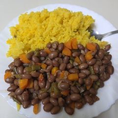 A picture of Fried turmeric rice with yellow beans.