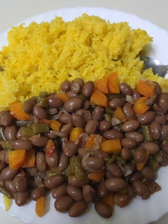 A picture of Fried turmeric rice with yellow beans.