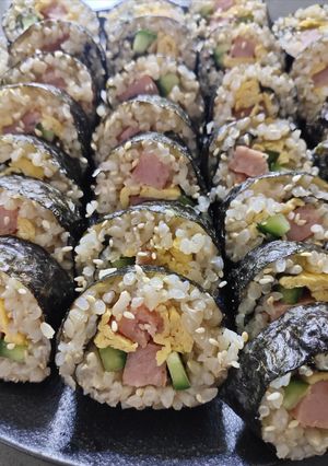 A picture of Sushi Rolls with Japanese Rice.