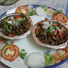 A picture of Mumbai juhu beach style butter sprouted green chana masala chaat.