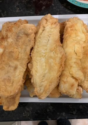Una foto de Milanesa de merluza a la marinera