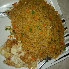 A picture of Spicy indomie with fried egg.