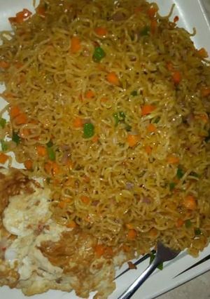 A picture of Spicy indomie with fried egg.