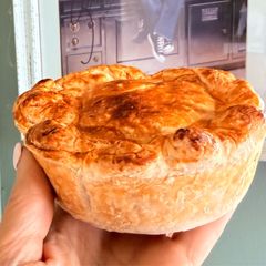 A picture of Lamb Rogan Paratha Pie.