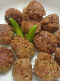 Til narkol postor bora (Sesame coconut and poppy seed fritters)