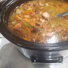 A picture of Crock pot leftover bone in ham lentil soup.