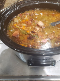A picture of Crock pot leftover bone in ham lentil soup.