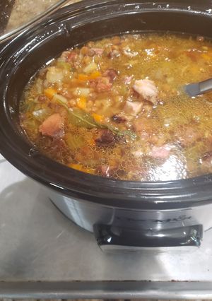 A picture of Crock pot leftover bone in ham lentil soup.