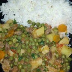 A picture of Beef stew and rice.