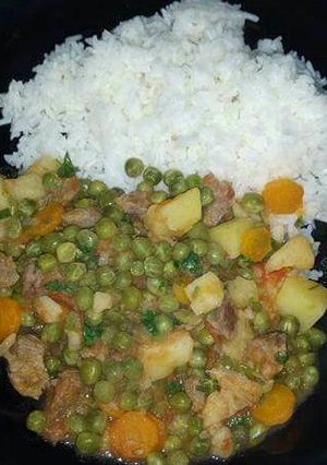 A picture of Beef stew and rice.