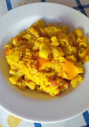 Una foto de Arroz meloso con coliflor, sepia y bacalao