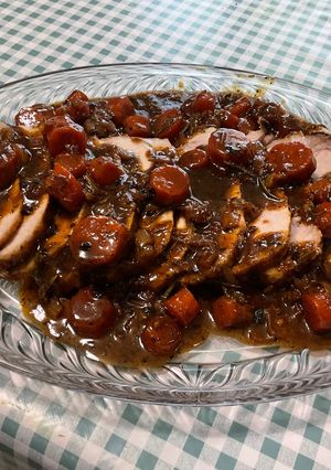 Une photo de Rôti de porc mariné aux carottes et herbes aromatiques