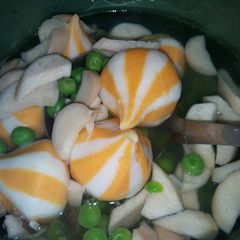 A picture of Clear Soup with Cheese Balls and King Oyster Mushroom.